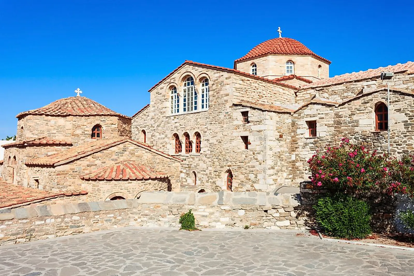 This church with 100 doors on this Greece island, also a perfect destination for windsurfing